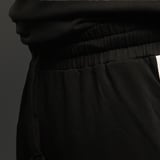 https://img10.hkrtcdn.com/40807/prd_4080689-MuscleBlaze-Straight-Fit-Panel-Trackpants-Black-XSmall_o.jpg